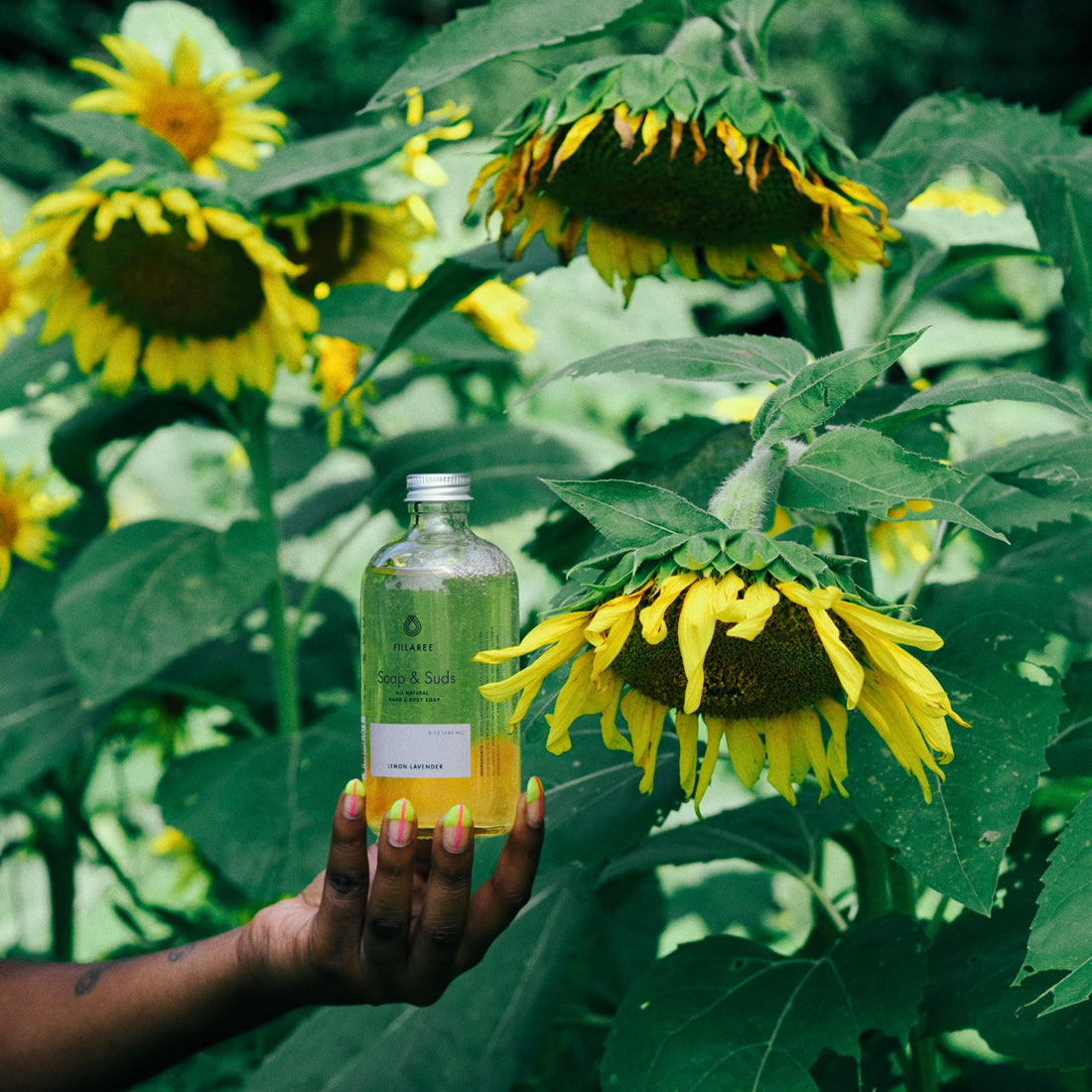 3 business women posing in sunflower feild