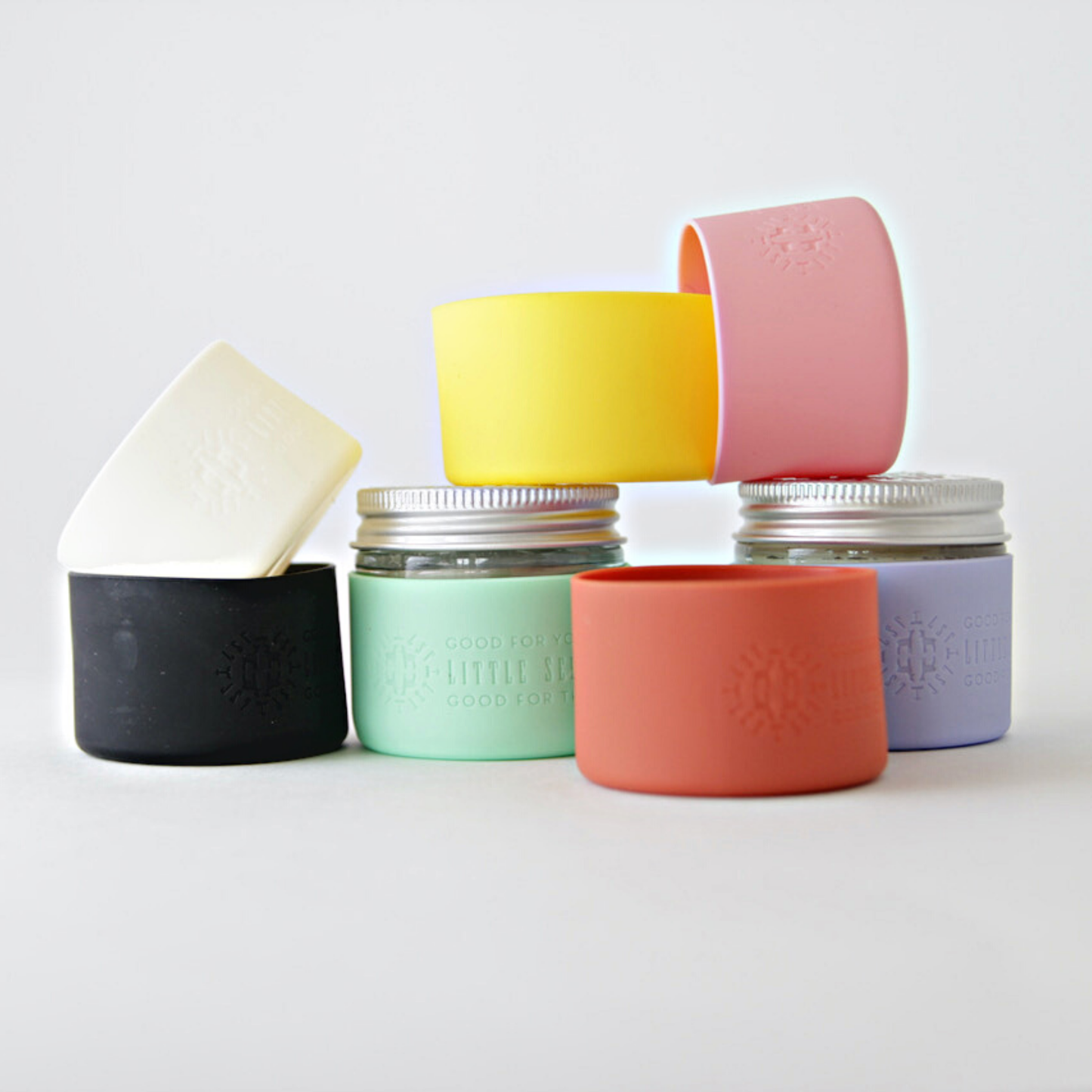 Fillaree Little Seed Farm Silicone Protector Sleeve: Made from 100% FDA food-grade silicone, this durable, non-toxic sleeve protects Little Seed Farm deodorant and balm jars from drops and chipping. The stretchy design with an air vent allows easy jar insertion and removal. Available in ten stylish colors, it reduces single-use plastic waste, offering an eco-friendly and practical solution for home or travel.