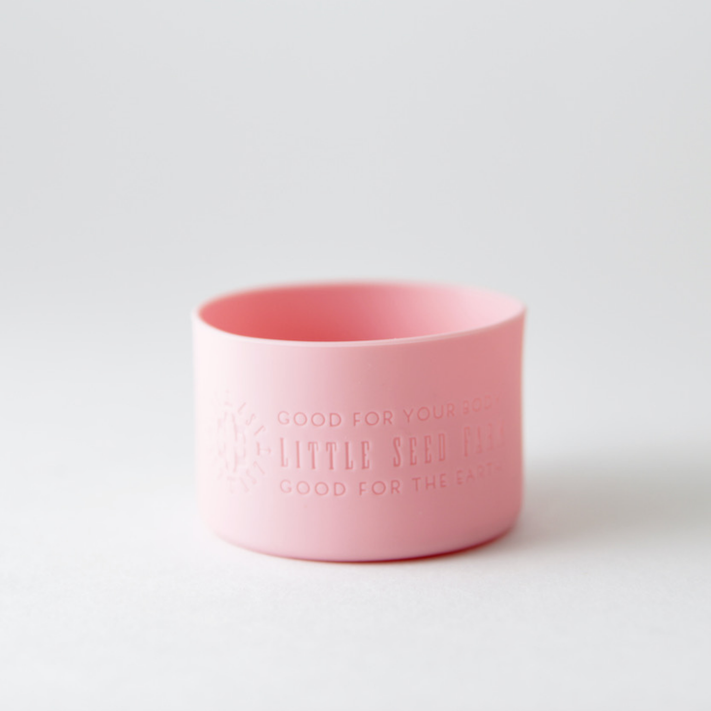 Fillaree Little Seed Farm Silicone Protector Sleeve: Made from 100% FDA food-grade silicone, this durable, non-toxic sleeve protects Little Seed Farm deodorant and balm jars from drops and chipping. The stretchy design with an air vent allows easy jar insertion and removal. Available in ten stylish colors, it reduces single-use plastic waste, offering an eco-friendly and practical solution for home or travel.