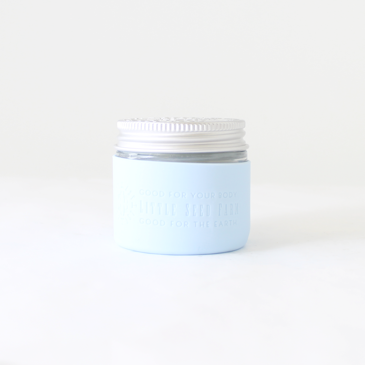 Fillaree Little Seed Farm Silicone Protector Sleeve: Made from 100% FDA food-grade silicone, this durable, non-toxic sleeve protects Little Seed Farm deodorant and balm jars from drops and chipping. The stretchy design with an air vent allows easy jar insertion and removal. Available in ten stylish colors, it reduces single-use plastic waste, offering an eco-friendly and practical solution for home or travel.
