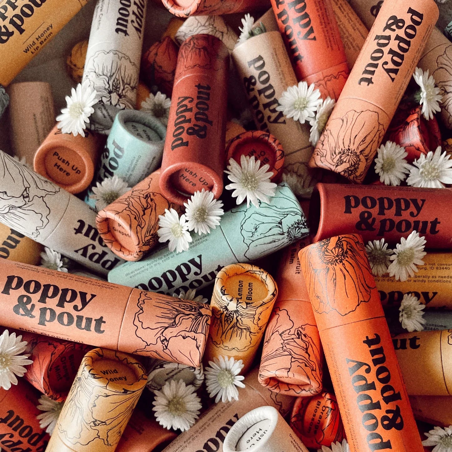Handmade Poppy & Pout Natural Lip Balm in Sweet Mint, Island Coconut, and Cinnamint. 100% natural, cruelty-free, and packed with hydrating organic coconut oil, beeswax, and sunflower oil for soft, nourished lips.
