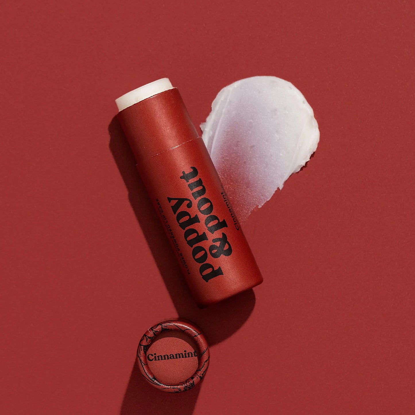 Handmade Poppy & Pout Natural Lip Balm in Sweet Mint, Island Coconut, and Cinnamint. 100% natural, cruelty-free, and packed with hydrating organic coconut oil, beeswax, and sunflower oil for soft, nourished lips.