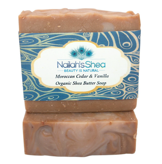 Nailah's Shea Moroccan Ghassoul Clay Soap – 100% natural, certified organic, and ethically sourced. Infused with Moroccan Ghassoul clay for skin detoxification, Cedarwood Atlas for oily and acne-prone skin, Bergamot for a bright complexion, and Vanilla for antioxidant protection. Vegan, paraben-free, and cruelty-free.